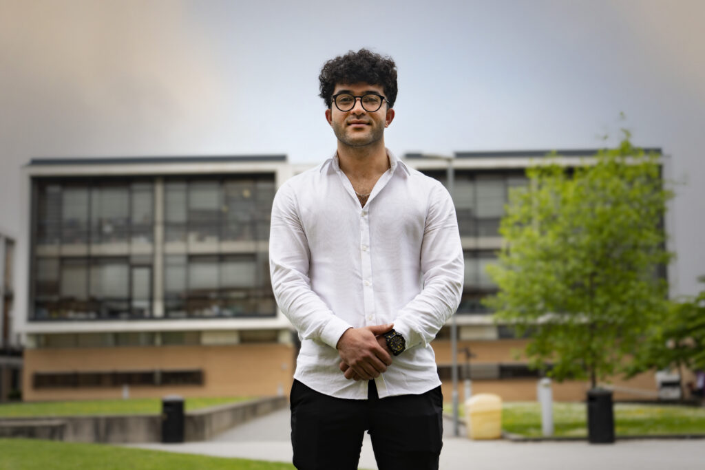 portrait photograph of male ESOL student standing outside Trafford College campus